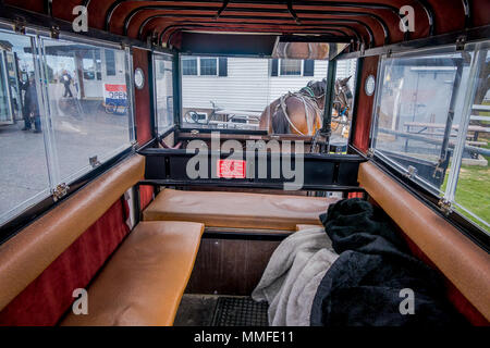 Pennsylvania, USA, APRIL, 18, 2018: Indoor view of the Amish buggy with a horse, waiting outside of a store Stock Photo