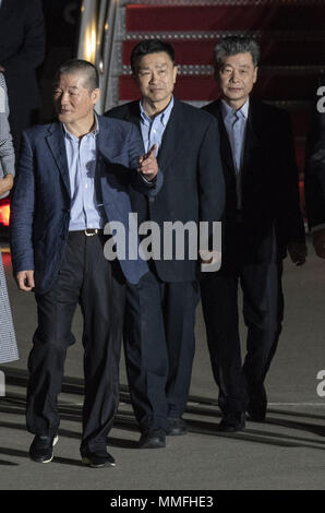 Joiunt Base Andrews, Maryland, USA. 9th May, 2018. Kim Dong Chul, Kim Hak Song and Kim Sang-duk, also known as Tony Kim, walk across the tarmac as they are welcomed back to the United States by US President Donald J. Trump at Joint Base Andrews in Maryland on Thursday, May 10, 2018. The three men were imprisoned in North Korea for periods ranging from one and two years. They were released to US Secretary of State Mike Pompeo as a good-will gesture in the lead-up to the talks between President Trump and North Korean leader Kim Jong Un.Credit: Ron Sachs/CNP (Credit Imag Stock Photo