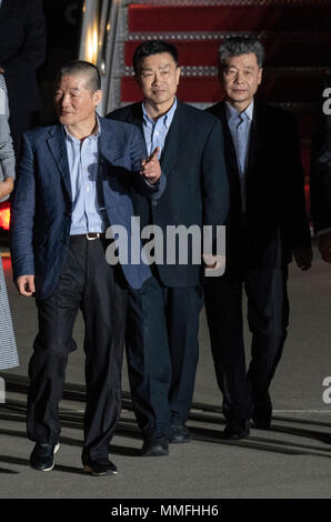 Kim Dong Chul, Kim Hak Song and Kim Sang-duk, also known as Tony Kim, walk across the tarmac as they are welcomed back to the United States by US President Donald J. Trump at Joint Base Andrews in Maryland on Thursday, May 10, 2018. The three men were imprisoned in North Korea for periods ranging from one and two years. They were released to US Secretary of State Mike Pompeo as a good-will gesture in the lead-up to the talks between President Trump and North Korean leader Kim Jong Un. Credit: Ron Sachs/CNP /MediaPunch Stock Photo