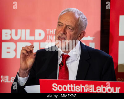 Glasgow, UK. 11 May, 2018. Labour Leader Jeremy Corbyn giving a speech in Govan, Glasgow in which he said that a Labour government will proactively support UK shipbuilding as part of a wider industrial strategy and called on the Conservative Government to guarantee three new Royal Fleet Auxiliary vessels will be built in domestic shipyards. Credit: Iain Masterton/Alamy Live News Stock Photo