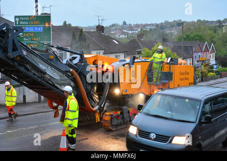 Bristol, UK. 11th May 2018. Workmen seen carrying out overnight resurfacing of the Wells Road A37, outbound Broadfield Road to Airport Road on Friday 11th may .Part of a larger on going scheme. Bristol City Council and North East Somerset Council made a joint bid to the Department of Transport for the Local Highways Maintenance Challenge Fund. Total amount awarded which includes a contribution from each authority is £6.4m Proposed carriageway reconstruction A4 and A4174 Corridors. Robert Timoney/Alamy/Live/News Stock Photo