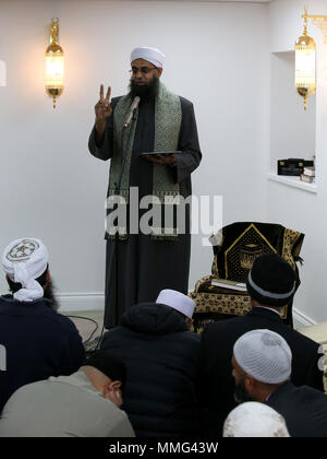 Iman Mufti Abdur Rahman Mangera speaks to members of the Muslim community in Stornoway on the Isle of Lewis as they attend the official opening of the first mosque in the Outer Hebrides. Stock Photo