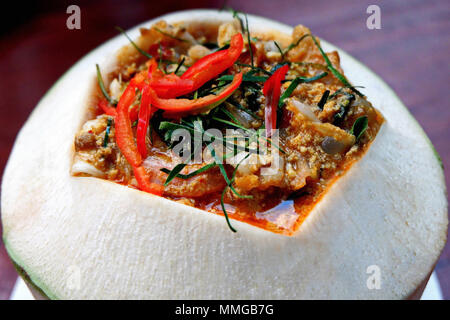 Thai Food - Steamed Fish with Curry Paste in Coconut Shell Stock Photo