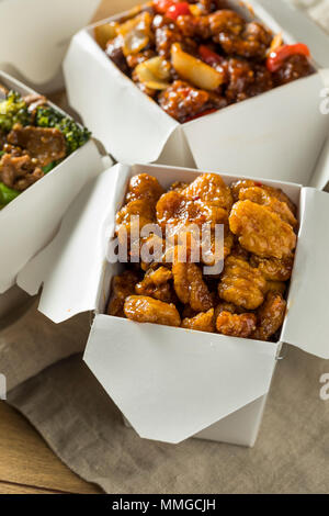 Spicy Chinese Take Out Food with Chopsticks and Fortune Cookies Stock Photo