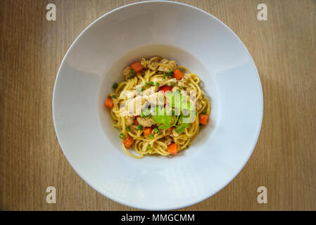 Stir-fried noodles with chicken Stock Photo