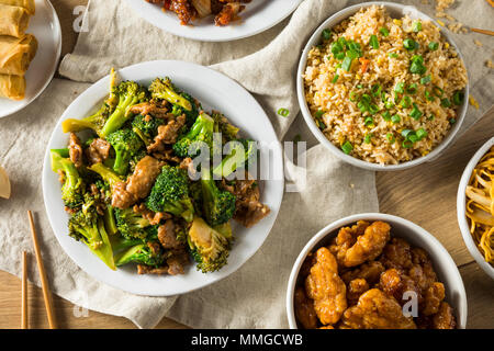Spicy Chinese Take Out Food with Chopsticks and Fortune Cookies Stock Photo