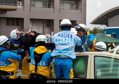 Aircraft mishap drill was a coordinated emergency response exercise conducted in Hiratsuka, Japan, involving local prefectural responders and U.S. military organizations in October 2017. The archival image documents a simulated casualty evacuation during the exercise, intended to improve joint response procedures and interagency coordination. Stock Photo