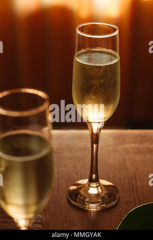 Flutes filled with sparkling prosecco, in a restaurant in Conegliano. Prosecco is a white sparkling wine cultivated and produced in Valdobbiadene Stock Photo