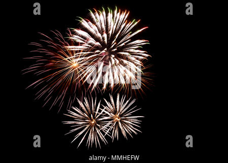 Colorful multi-colored fireworks, salute on the background of the black sky on holiday Stock Photo