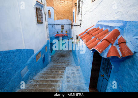 Small rustic staircase street in Chefchaouen, the Blue city, in Morocco Stock Photo