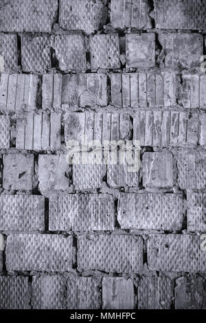 The old wall of a square red brick. Background and texture. Black and white photo Stock Photo