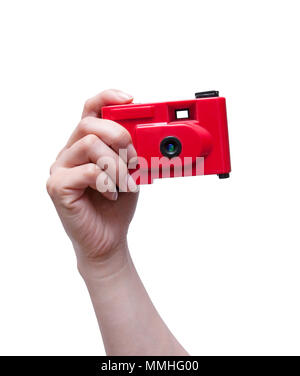 Camera in a hand isolated on white background Stock Photo