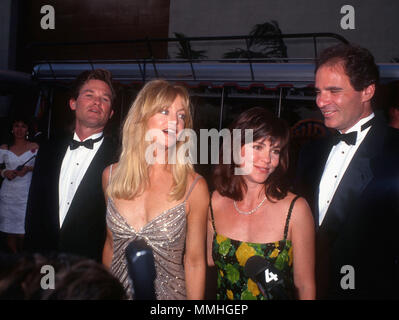 BURBANK, CA - JUNE 02: (L-R) Actor Kurt Russell, actress Goldie Hawn, actress Sally Field and Alan Greisman attend Warner Bros. Studio Rededication event at Warner Bros. Studios on June 2, 1990 in Burbank, California. Photo by Barry King/Alamy Stock Photo Stock Photo