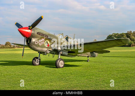 Peter Teichman's 1943 Curtiss P-40M Kittyhawk 43-5802/G-KITT pictured parked in the sunshine at Old Warden UK in 2011. It is painted as P-40L Warhawk  Stock Photo