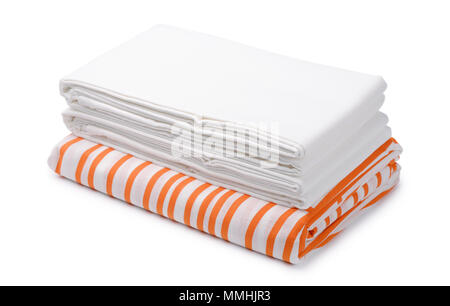 Stack of folded white and color bedding sheets isolated on white Stock Photo