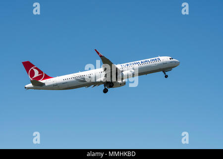 Airbus A321-231, narrow-body, commercial passenger twin-engine jet airliner from Turkish Airlines in flight against blue sky