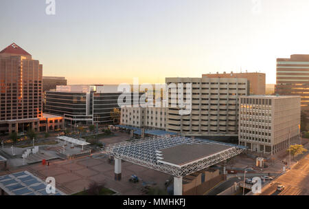 Early evening in springtime, Downtown Albuquerque Civic Plaza and Government buildings, New Mexico. Petroglyph NP volcanoes visible in the distance. Stock Photo