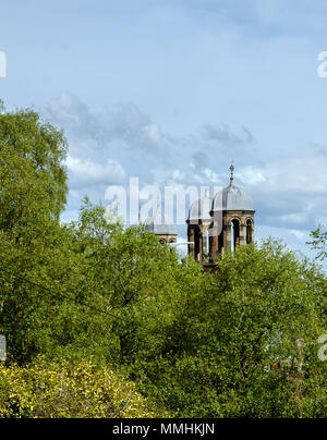 GLASGOW, SCOTLAND - MAY 12th 2018: One of the Glasgow Victoria Infirmary's pavilion being seen through the trees in Queens Park. Stock Photo