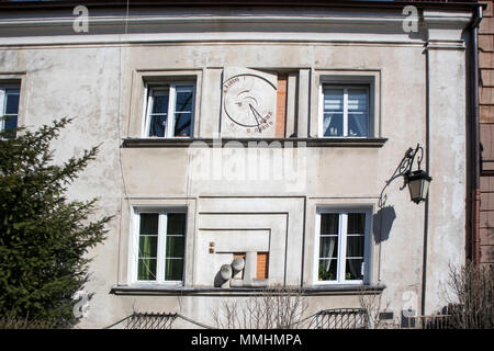 WARSAW, POLAND - APRIL 28, 2018: Ancient sundial on the external wall of building in Warsaw Stock Photo