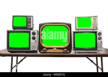 Five vintage televisions isolated on white with chroma green screens and clipping path. Stock Photo