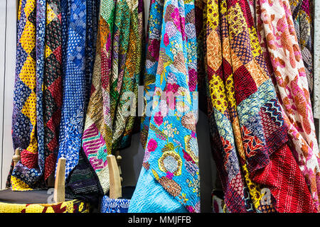 Beautiful Kashmiri curtains, fabric and embroidery hanging on wall at fabric store in China Stock Photo