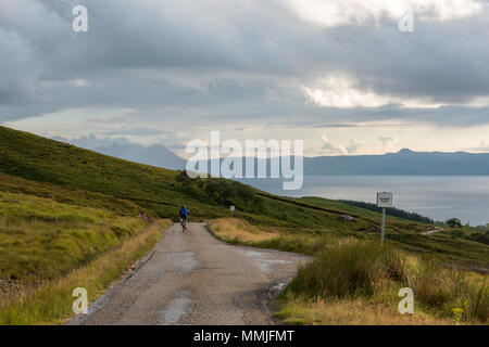 Cycling the Bealach na BÃ . On the decent close to Applecross, the Inner Sound and Skye filling the background.