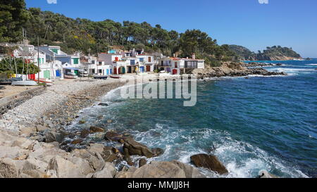 Old fishermen houses on coast with a pebble beach, Cala S'Alguer, Palamos, Mediterranean sea, Spain, Costa Brava, Catalonia, Girona, Baix Emporda Stock Photo