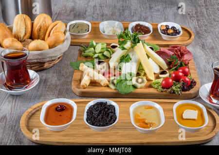 Rich and delicious Turkish breakfast on white wood table Stock Photo