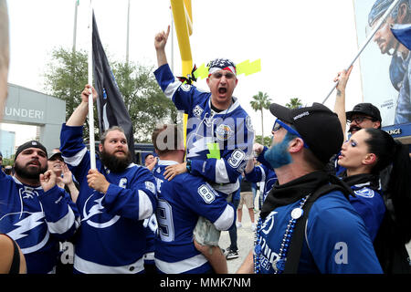 Tampa, Florida, USA. 11th May, 2018. DOUGLAS R. CLIFFORD | Times .Brian Levine, of Tampa, is hoisted into the air while expressing his support for the Lightning while cheering with the Sticks of Fire (fan club) in Thunder Alley before Fridays game between the Tampa Bay Lightning and the Washington Capitals in game 1 of the Eastern Conference Final at Amalie Arena in Tampa. Credit: Douglas R. Clifford/Tampa Bay Times/ZUMA Wire/Alamy Live News Stock Photo