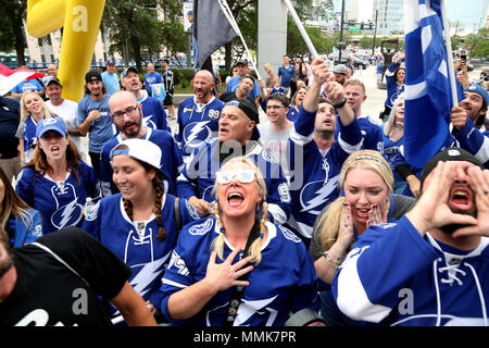 Tampa, Florida, USA. 11th May, 2018. DOUGLAS R. CLIFFORD | Times .Fans with the Sticks of Fire make their way through Thunder Alley before Fridays game between the Tampa Bay Lightning and the Washington Capitals in game 1 of the Eastern Conference Final at Amalie Arena in Tampa. Credit: Douglas R. Clifford/Tampa Bay Times/ZUMA Wire/Alamy Live News Stock Photo