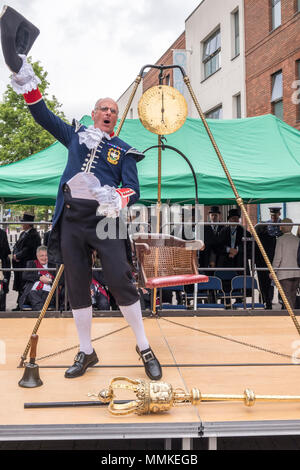 Saturday May 12th 2018. High Wycombe, Buckinghamshire, England, GB, UK. The quaint local tradition of 'Weighing in the Mayor' took place in the town centre today.  Traditionally, the outgoing and incoming mayor and civic officials are weighed at the beginning of the mayor's term of office each year to ascertain if they have gained weight at the expense of the taxpayer. Credit: D. Callcut/Alamy Live News Stock Photo