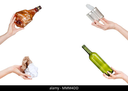 Hands holding crumpled paper, empty glass and plastic bottles, tin can isolated on white background. Copyspace for text. Recycling, reuse, garbage dis Stock Photo