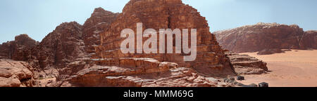 Composite panorama of high resolution aerial photos of a monolithic mountain in the central area of the desert reserve of Wadi Rum, Jordan, middle eas Stock Photo