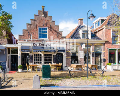 Front facades of historic houses now cafes in city centre of old town of Workum, Friesland, Netherlands Stock Photo