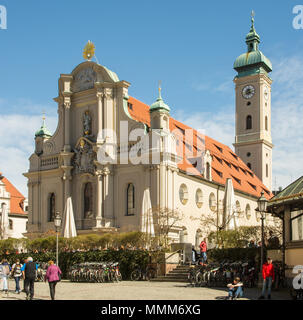 MUNICH, GERMANY - APRIL 4:  People at the Heilig-Geist-Kirche church in Munich, Germany on April 4, 2018. Stock Photo