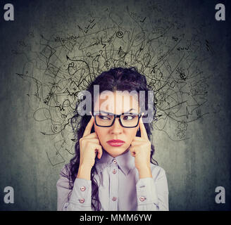 Thoughtful stressed young woman with a mess in her head Stock Photo