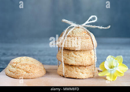 Cookies tied with a rope on a gray-blue background. Selective focus Stock Photo