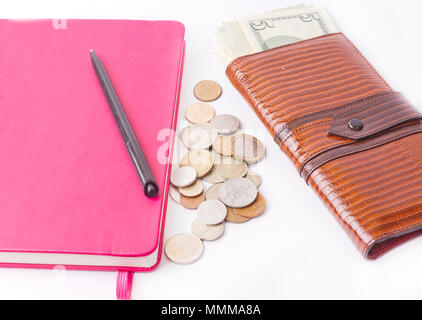 Diary with money and pen isolated on white background Stock Photo
