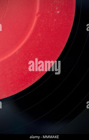 Detail of a seven inch vinyl record with a red label Stock Photo