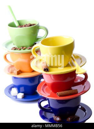 Colored cups of coffee, coffee beans, sugar and cinnamon stick on a white background Stock Photo