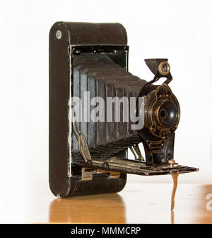 Photo of an old antique folding Kodak Brownie Camera No. 2c. Shown here in it's extended position showing the bellows and kick stand. Stock Photo