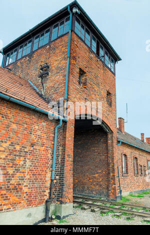 Auschwitz, Poland - August 12, 2017: gates and railroad entering the Auschwitz Birkenau concentration camp Stock Photo