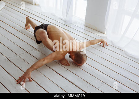 Man Practicing Advanced Yoga. A Series Of Yoga Poses. Lifestyle Concept  Stock Photo, Picture and Royalty Free Image. Image 72143123.
