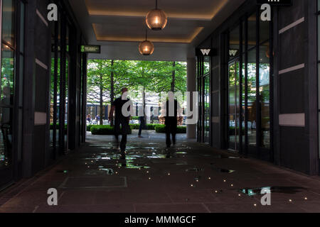 People walk through Denman Place towards Ham Yard Hotel in Soho, London Stock Photo