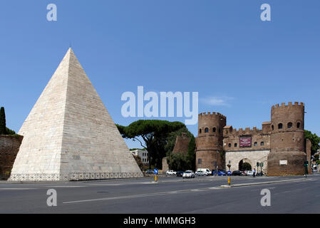 The Pyramid of Caius Cestius and the twin towered Porta San Paolo in the Rome neighbourhood of Testaccio. The Pyramid (Piramide di Caio Cestio) was bu Stock Photo