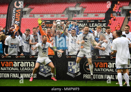 Tranmere Rovers' James Norwood (left), Connor Jennings (right) and team-mates celebrate with the trophy after the game during the Vanrama National League Play-off Final at Wembley Stadium, London. Stock Photo