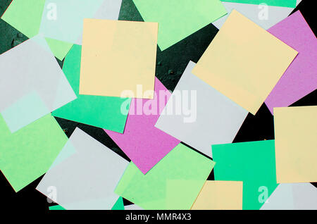 lot of various colored note papers on black background Stock Photo