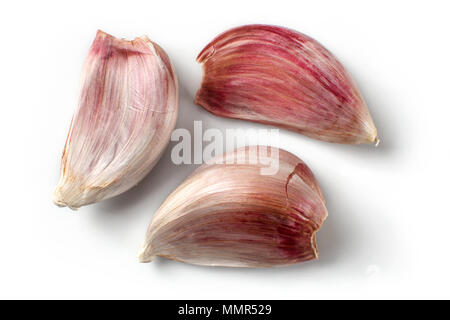 Top view on three purple garlic cloves isolated (with shadows) on white background. Stock Photo