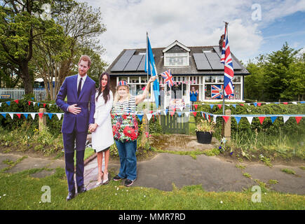 Angela Rooke with her house near Tadcaster in Yorkshire, that has been decorated ahead of the royal wedding of Prince Harry and Meghan Markle. Stock Photo
