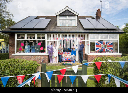 Angela and Richard Rooke and their daughter Jessica with their house near Tadcaster in Yorkshire, that they have decorated ahead of the royal wedding of Prince Harry and Meghan Markle. Stock Photo